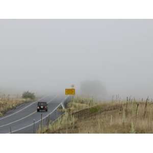 Vehicle Slows as it Approaches a Bank of Coastal Fog with Near Zero 