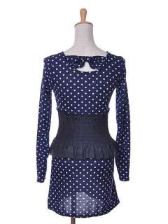 Blue in color, this long sleeve dress has polka dots throughout the 