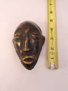 Small Metal African Mask Eyes Closed 5 tall x 3 wide  