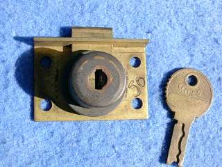 The next two photos show an identical lock fitted on the coin box door 