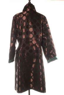   and fun this lovely coat has a button front placate and fitted bodice