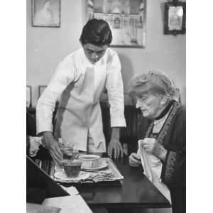  A Young Man Serving Gertrude Atherton Tea in Her Study 