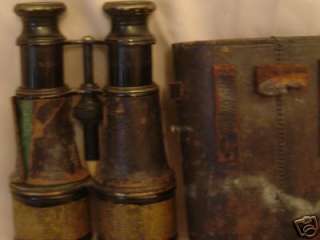 you are bidding on a set of antique binoculars they are merchant 