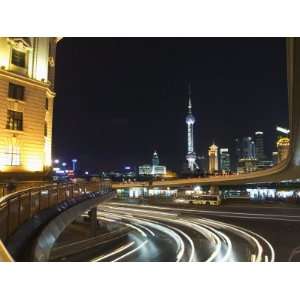 Car Light Trails on the Bund and the Oriental Pearl Tower Illuminated 