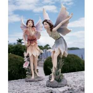    Blowing a Kiss Sculpture and Taking Flight Fairy