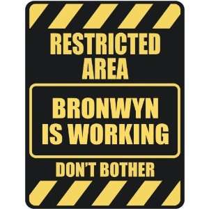   RESTRICTED AREA BRONWYN IS WORKING  PARKING SIGN