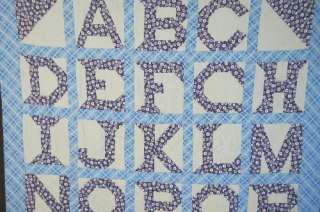  cotton alphabet quilt is hand pieced and hand quilted, with the date 