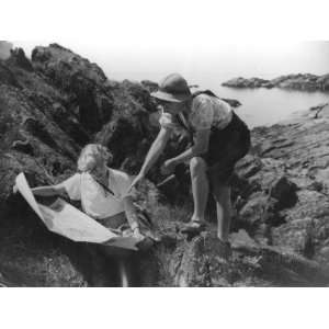  Two Female Hikers on a Coastal Route Stop and Consult their Map 