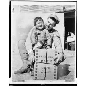  U.S. Marine with Korean girl and CARE package 1953