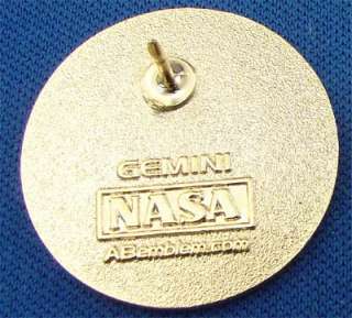  , the NASA contractor for mission emblems. It is 1 inch in diameter