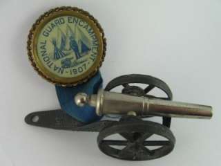 1907 GAR NATIONAL GUARD ENCAMPMENT PINBACK PIN BADGE MEDAL WITH CANNON 