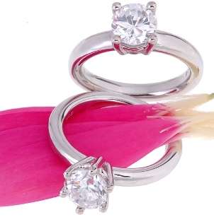   round brilliant diamond solitaire engagement rings with a pink flower