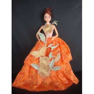Tangerine Strapless Ball Gown with a Large Flower Accent Made to Fit 