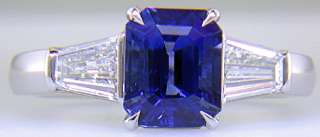 cut Sapphire with tapered baguette diamonds in a custom platinum ring 