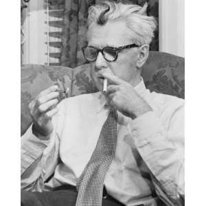 1954 photo James Thurber, half length portrait, seated, facing right 