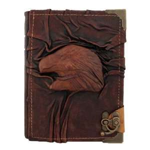   Eagle Head Sculpture on a Brown Handmade Leather Bound Journal MO104