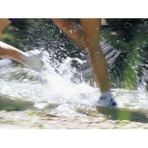  Runners Legs Splashing Through a Creek National Geographic 